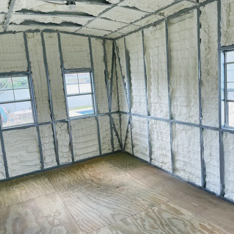 Closed-cell spray foam insulation applied to wall cavities in a residential project in Shelley